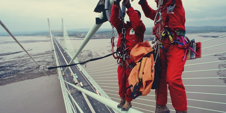 Workers on damper cables