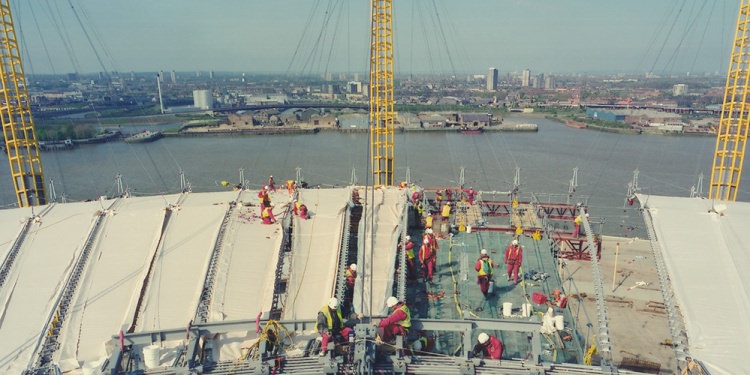 Millenium done with workers on the roof.