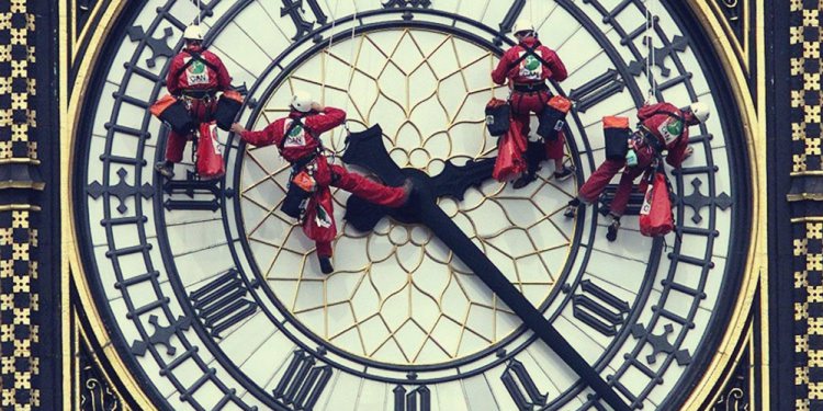 CAN workers on the face of Big Ben's clock.