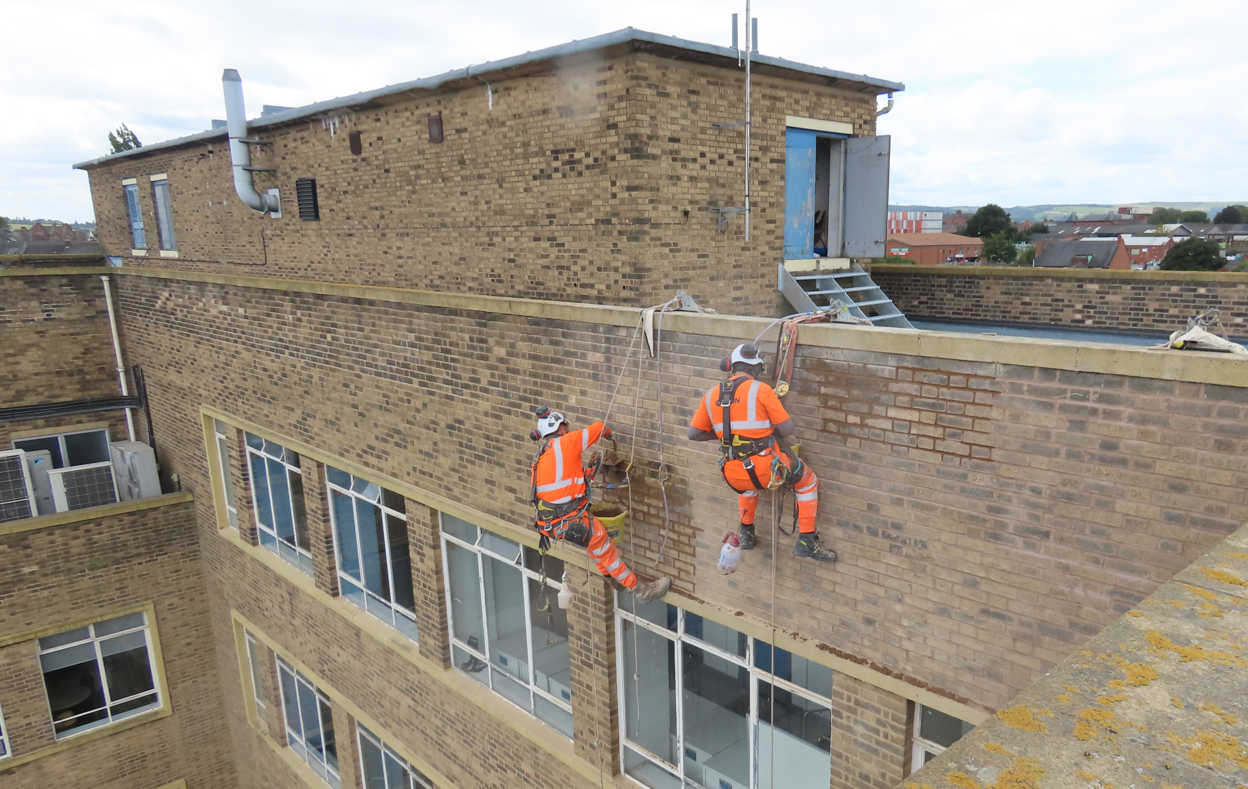 Workers on the side of Chesterfield College